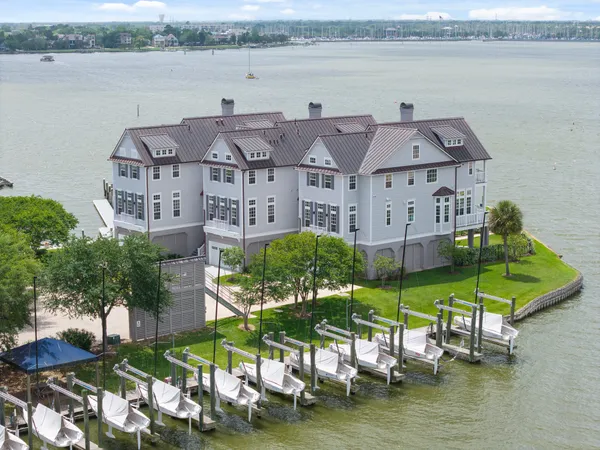 an aerial view of a house with a lake view