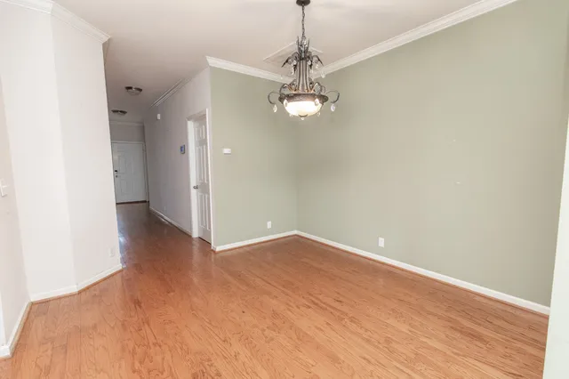 a large kitchen with granite countertop a stove and a sink