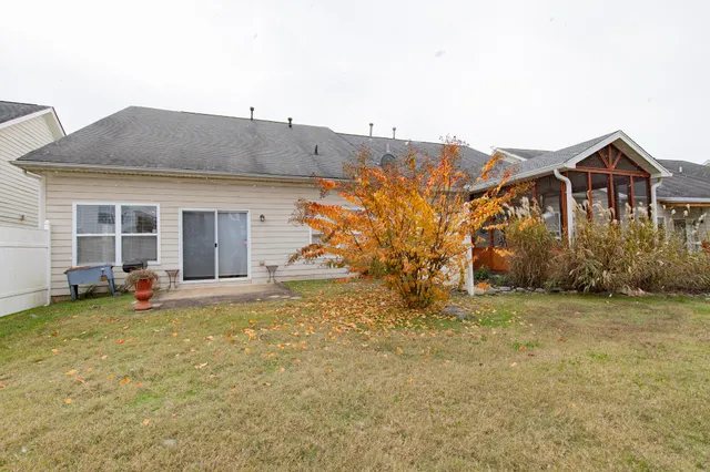 a view of a patio with a table and chairs