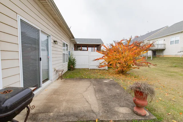a view of a lake with houses in the background