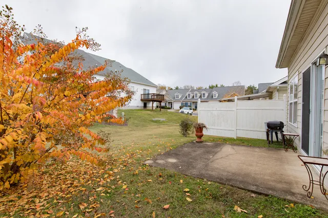a view of a lake with couches and wooden floor