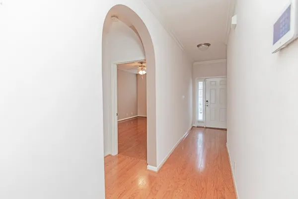 a view of a room with wooden floor
