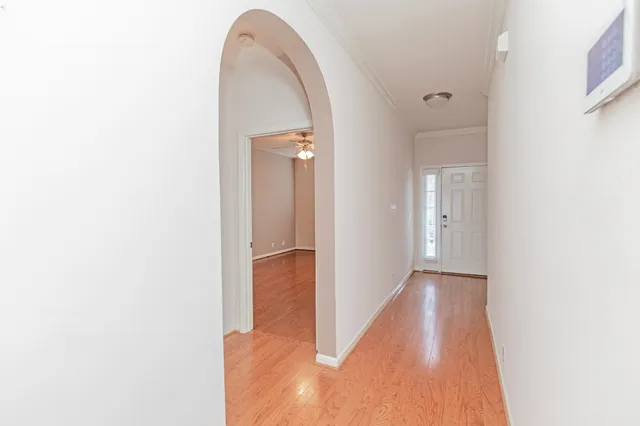 a view of a room with wooden floor