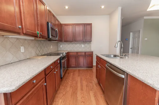 a bathroom with a sink a mirror and a window