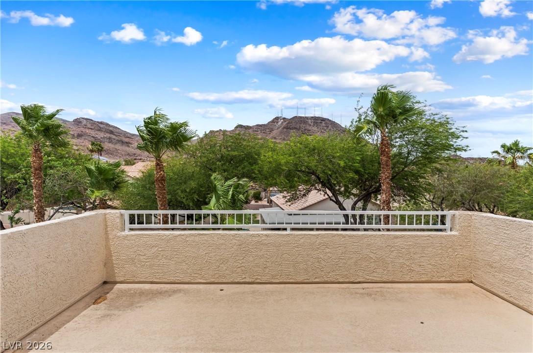 708 Vortex Avenue Henderson, NV 89002 - Photo 36 of 71 Enjoy desert vistas and lush palms from this private outdoor balcony.