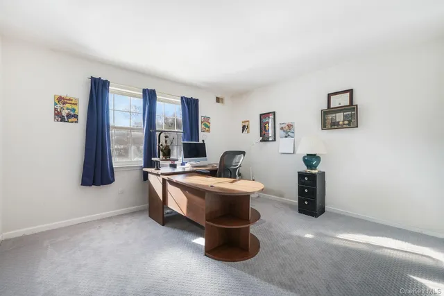 a bathroom with a sink toilet and mirror
