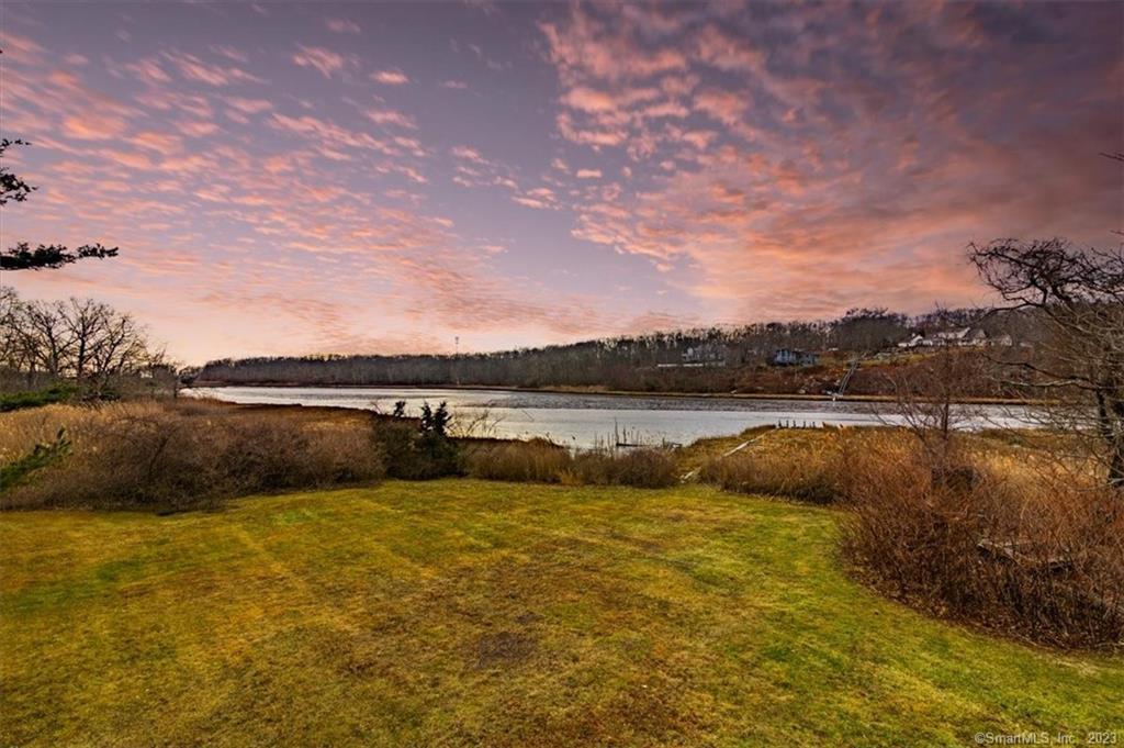 14 Gada Road East Lyme, CT 06357 - Photo 1 of 1 a view of a lake with houses in the back