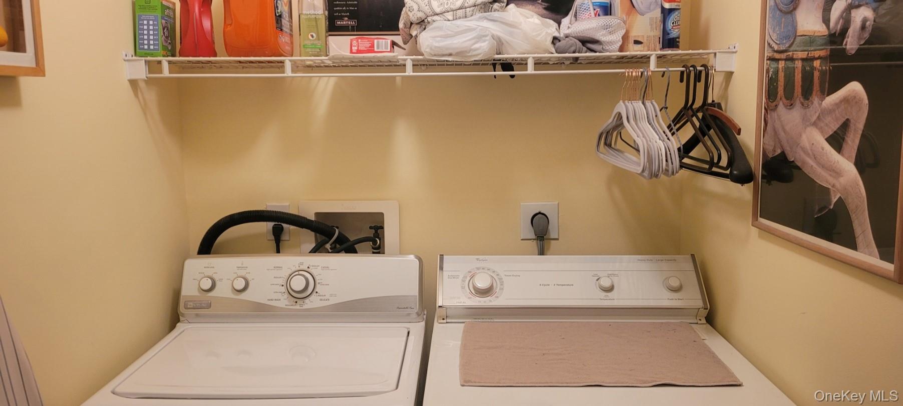 312 Riley Avenue Calverton, NY 11933 - Photo 11 of 30 Dedicated First Floor laundry area featuring a wire storage shelf, light-toned walls, and utility hookups