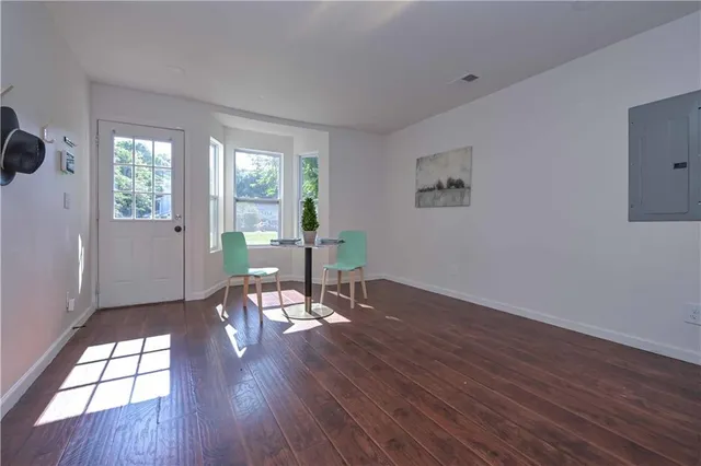 a view of a livingroom with furniture window and wooden floor
