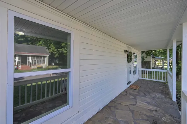 a view of a house with porch and wooden floor