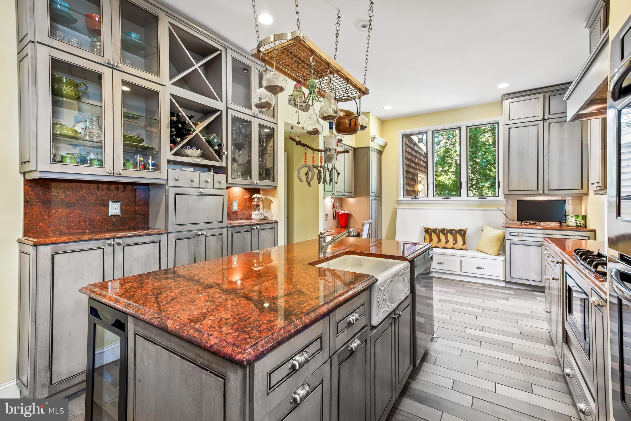 14 Midvale Road Baltimore, MD 21210 - Photo 35 of 91 a kitchen with stainless steel appliances granite countertop a stove and a wooden cabinets