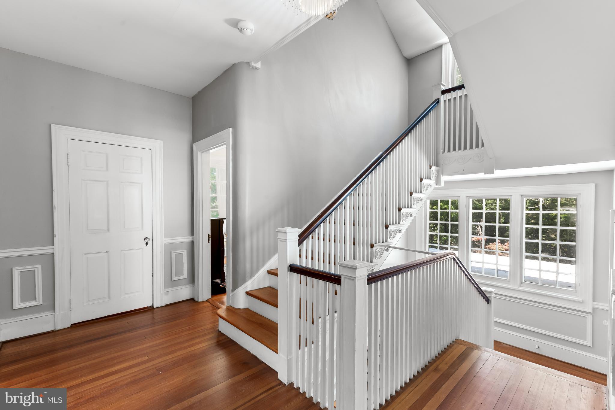 14 Midvale Road Baltimore, MD 21210 - Photo 43 of 91 a view of staircase with wooden floor and white walls