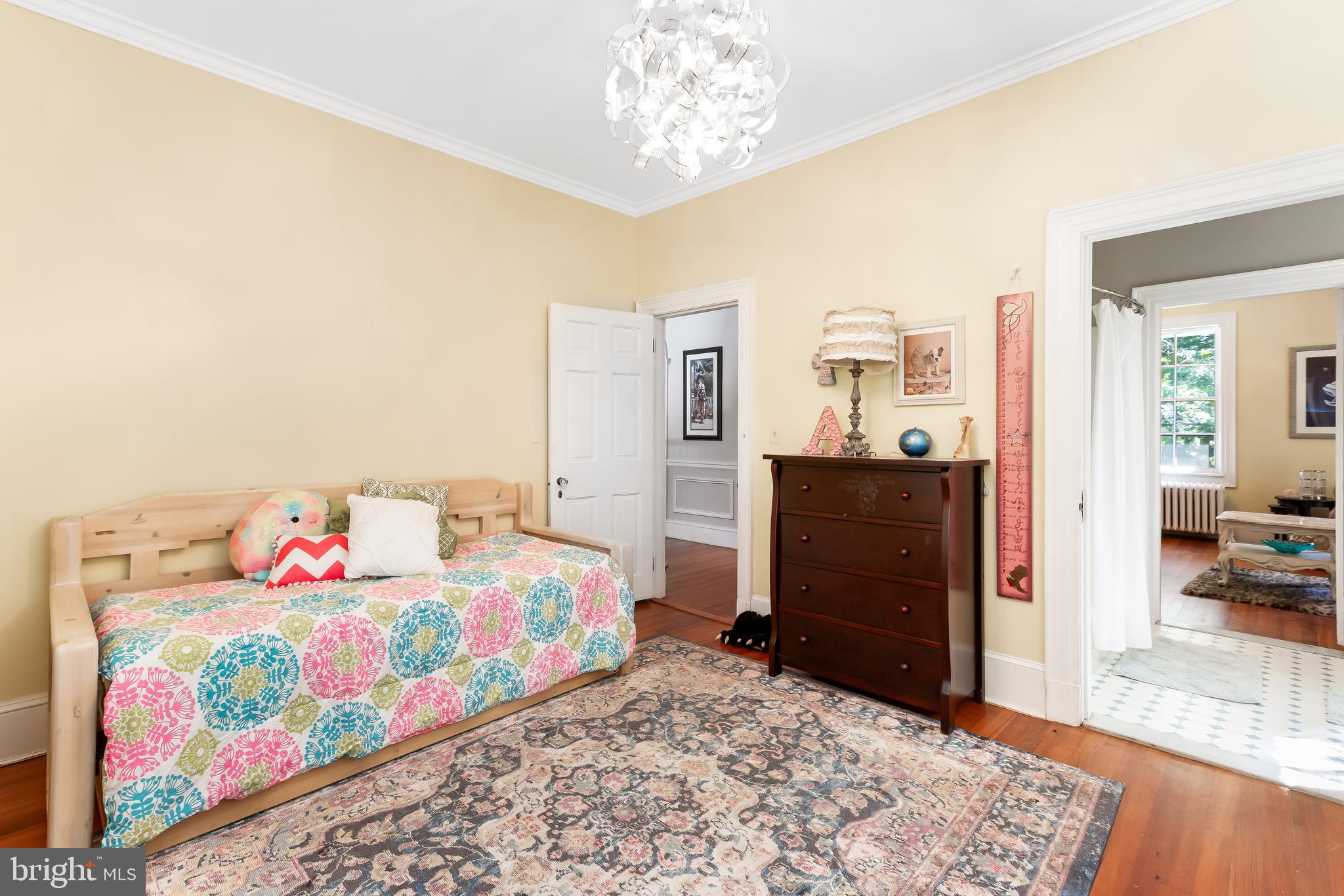 14 Midvale Road Baltimore, MD 21210 - Photo 48 of 91 a bedroom with a bed and wooden floor