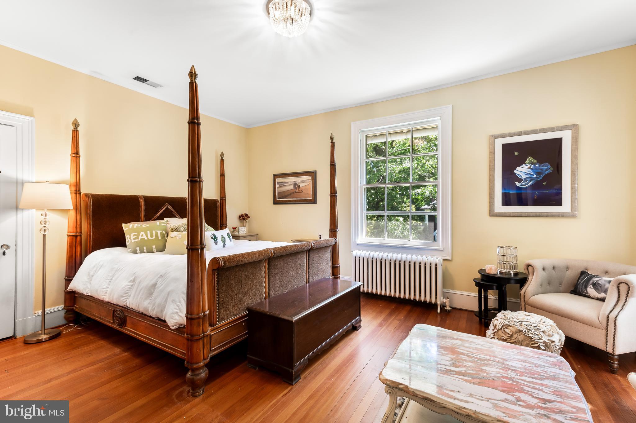 14 Midvale Road Baltimore, MD 21210 - Photo 49 of 91 a bedroom with a bed wooden floor and window