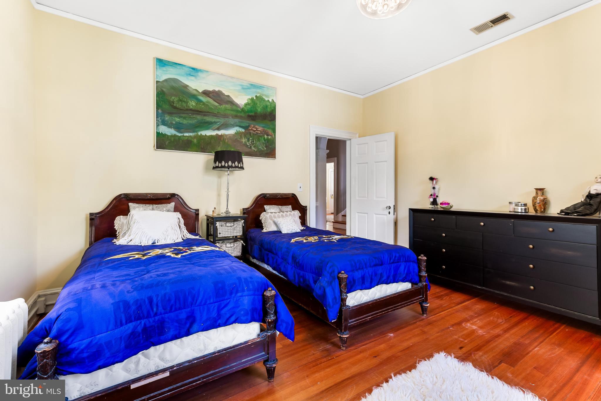 14 Midvale Road Baltimore, MD 21210 - Photo 51 of 91 a bedroom with two beds and a painting on the wall
