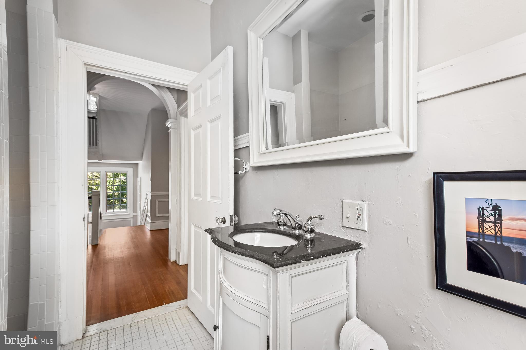 14 Midvale Road Baltimore, MD 21210 - Photo 54 of 91 a kitchen with granite countertop a sink stove and cabinets