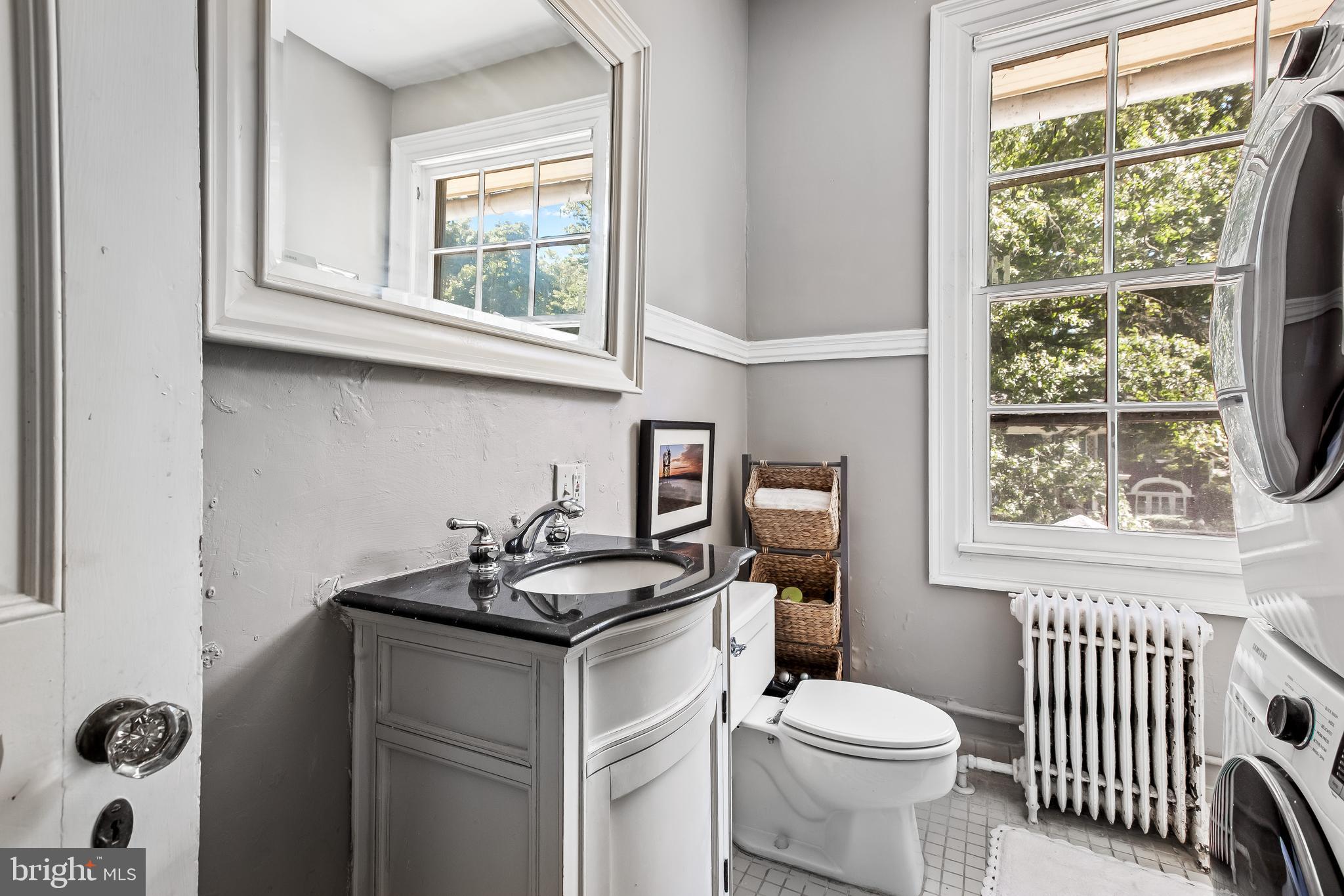 14 Midvale Road Baltimore, MD 21210 - Photo 55 of 91 a bathroom with a sink a toilet and a window