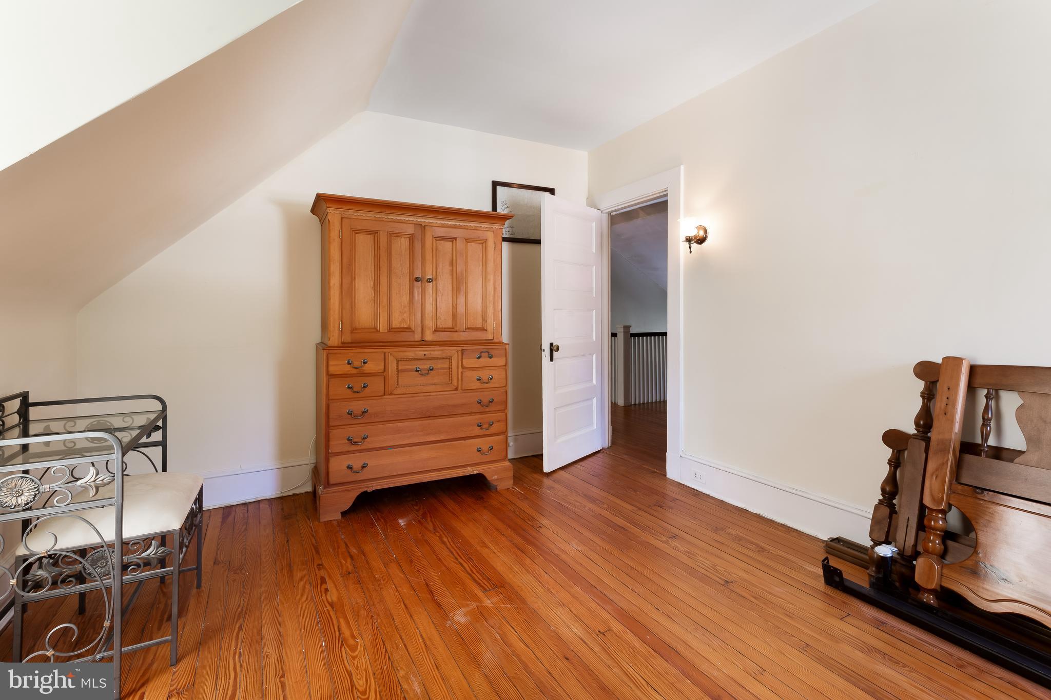 14 Midvale Road Baltimore, MD 21210 - Photo 60 of 91 a view of a room with wooden floor and chair