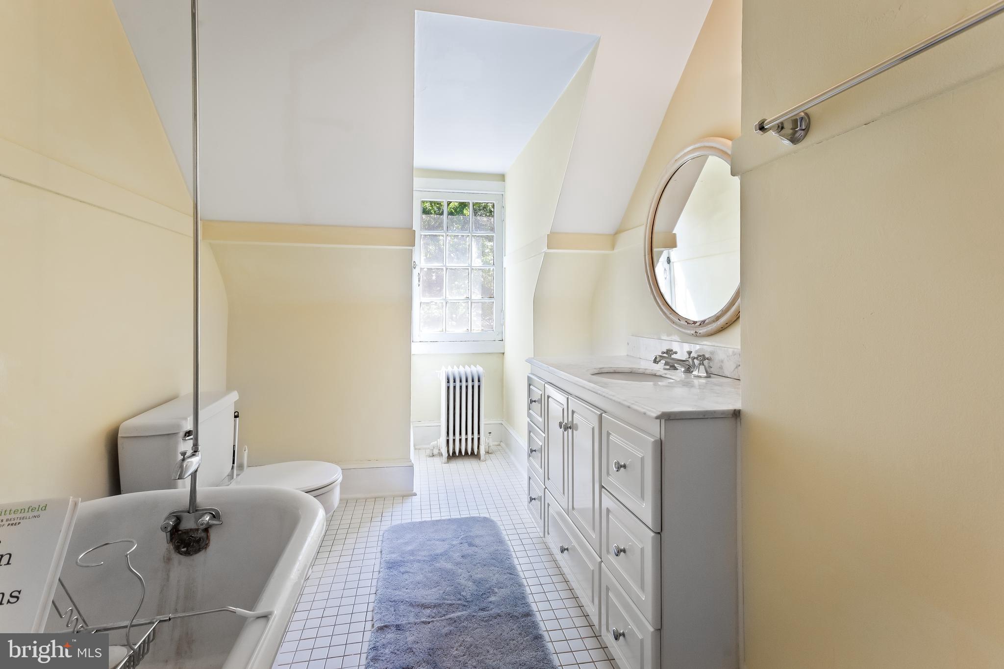 14 Midvale Road Baltimore, MD 21210 - Photo 61 of 91 a spacious bathroom with a granite countertop sink and a mirror