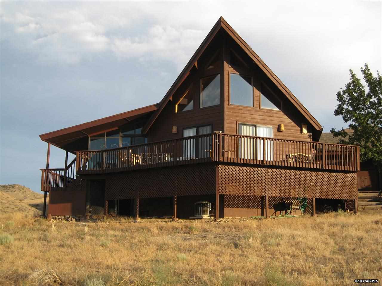 3050 Ironwood Road Reno, NV 89510 - Photo 1 of 1 a view of a house with large windows