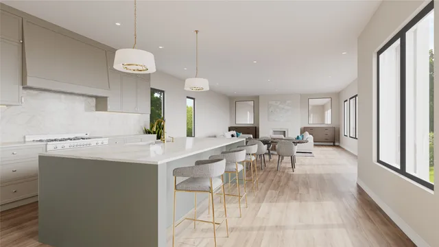 a very nice looking dining room with a large window and stainless steel appliances