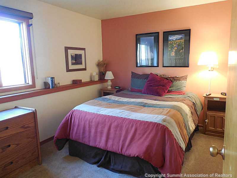 91300 Ryan Gulch Road, Unit 307 Silverthorne, CO 80498 - Photo 14 of 25 Master Bedroom.