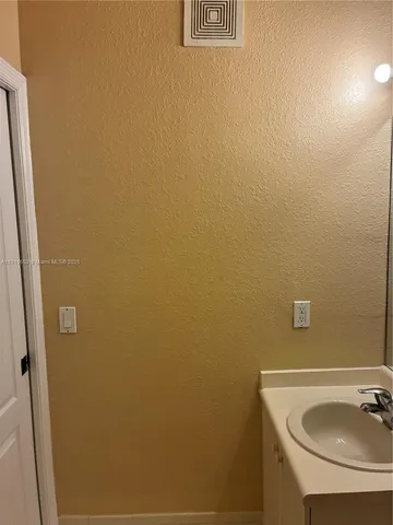 a close up view of a sink a washer and dryer