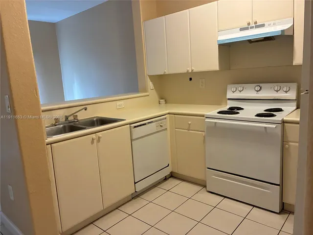 an empty room with wooden floor