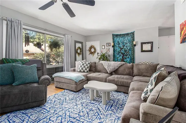 a living room with furniture and a large window