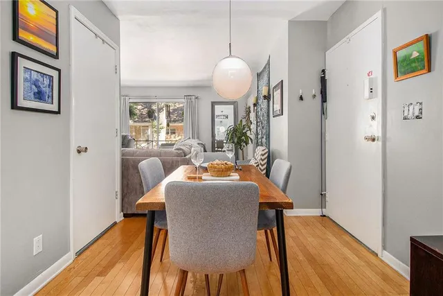 a dining room with furniture and window