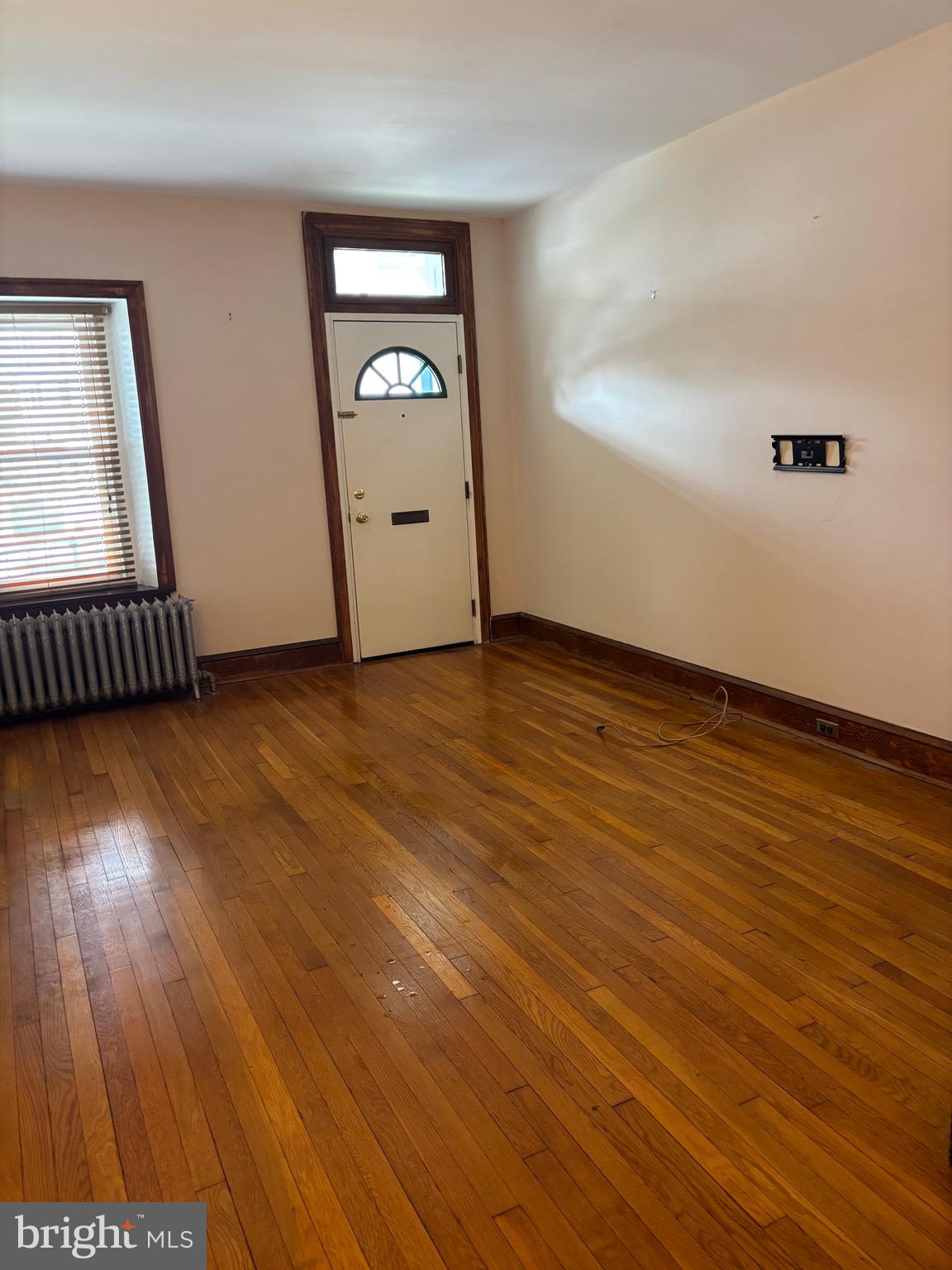 6783 Ridge Avenue Philadelphia, PA 19128 - Photo 3 of 26 an empty room with wooden floor and windows