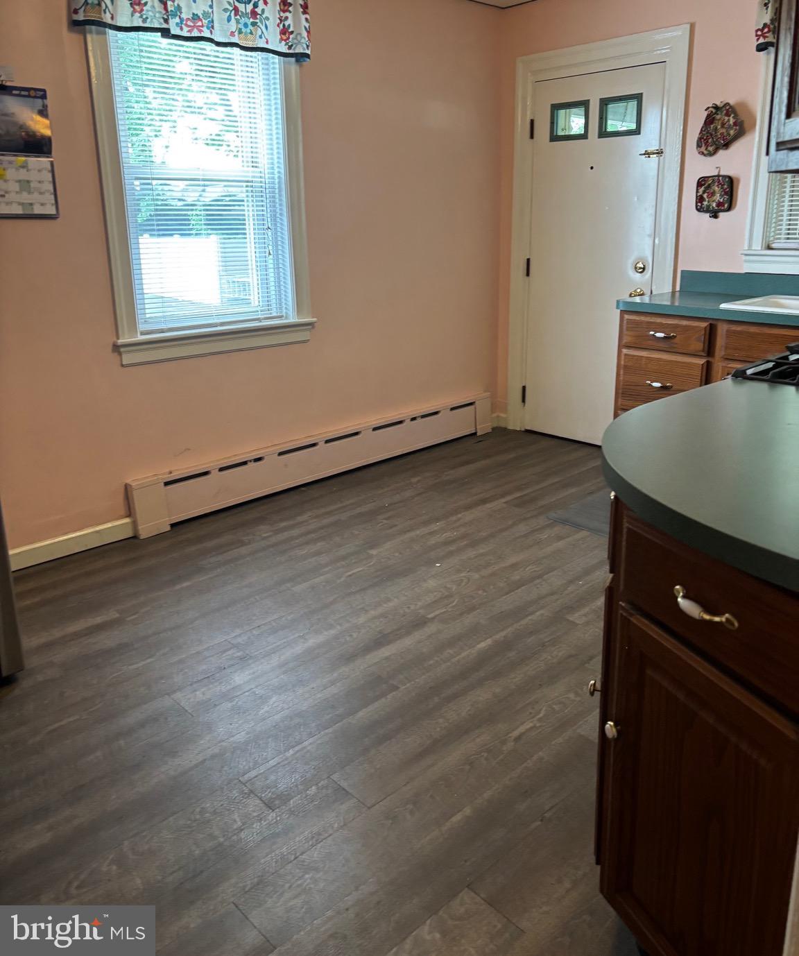 6783 Ridge Avenue Philadelphia, PA 19128 - Photo 10 of 26 an empty room with wooden floor and window