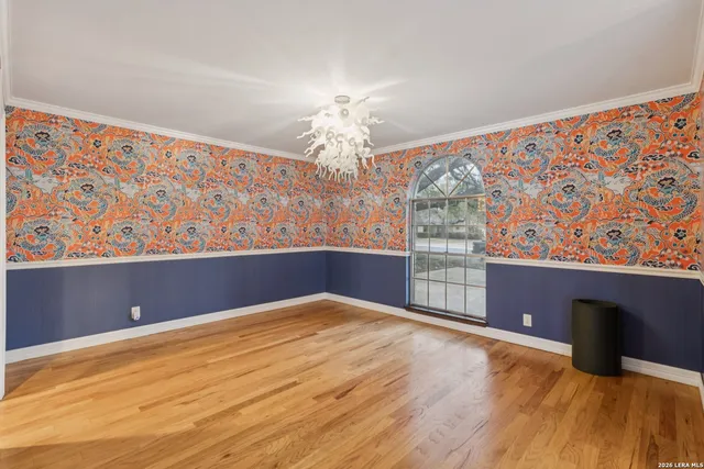 a view of kitchen with furniture and a chandelier