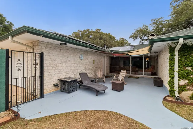 a view of house with patio outdoor seating