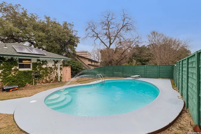 a view of a swimming pool with a garden