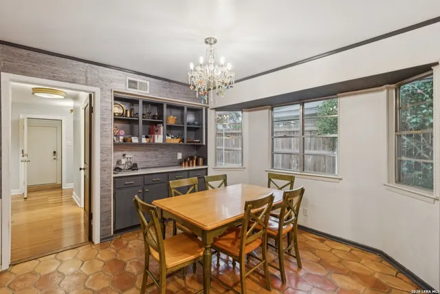 a dining room with furniture and window