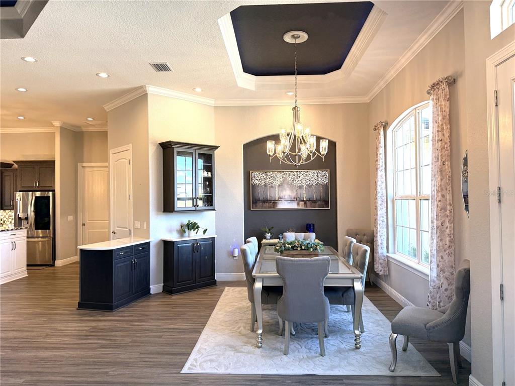 17898 Southwest 72nd Street Road Dunnellon, FL 34432 - Photo 15 of 85 a dining room with wooden floor and breakfast area