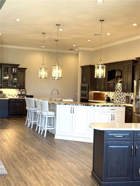 17898 Southwest 72nd Street Road Dunnellon, FL 34432 - Photo 20 of 85 a kitchen with stainless steel appliances kitchen island granite countertop a sink and cabinets