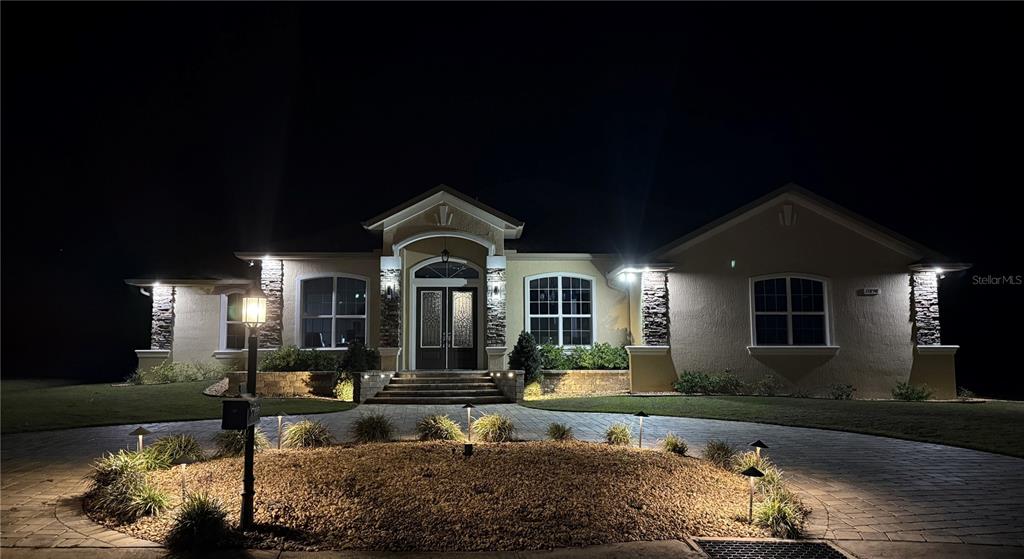 17898 Southwest 72nd Street Road Dunnellon, FL 34432 - Photo 2 of 85 a front view of a house with a yard