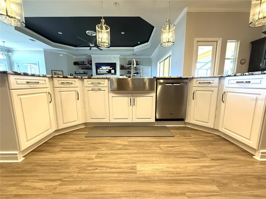 17898 Southwest 72nd Street Road Dunnellon, FL 34432 - Photo 21 of 85 a view of a kitchen with stainless steel appliances kitchen island granite countertop a sink cabinets and a large window