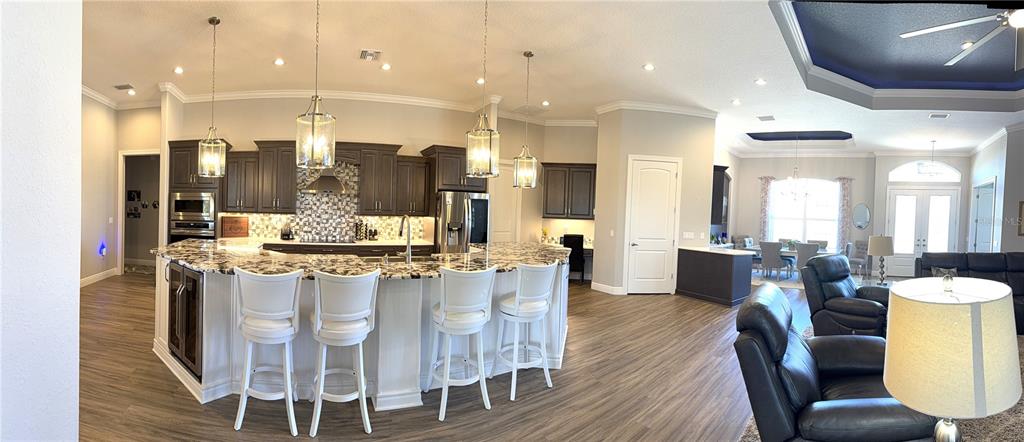 17898 Southwest 72nd Street Road Dunnellon, FL 34432 - Photo 28 of 85 a large kitchen with a table and chairs