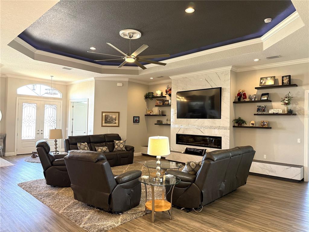 17898 Southwest 72nd Street Road Dunnellon, FL 34432 - Photo 30 of 85 a living room with furniture and a flat screen tv