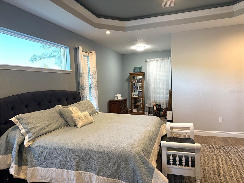 17898 Southwest 72nd Street Road Dunnellon, FL 34432 - Photo 34 of 85 a bedroom with a bed and window