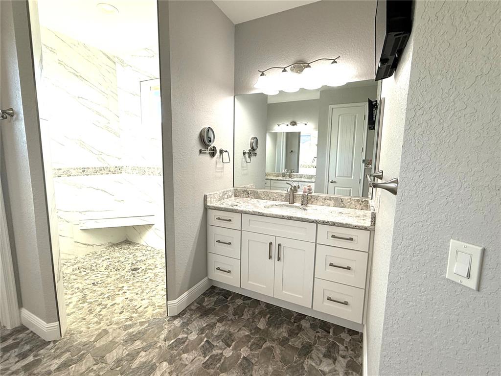 17898 Southwest 72nd Street Road Dunnellon, FL 34432 - Photo 39 of 85 a bathroom with a double vanity sink mirror and