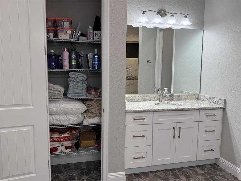17898 Southwest 72nd Street Road Dunnellon, FL 34432 - Photo 41 of 85 a bathroom with a double vanity sink and a mirror