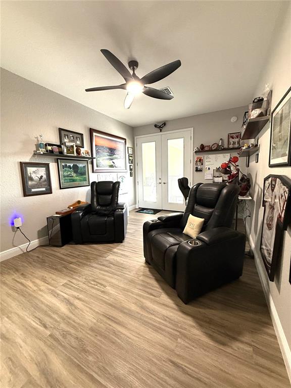 17898 Southwest 72nd Street Road Dunnellon, FL 34432 - Photo 59 of 85 a living room with furniture and a flat screen tv