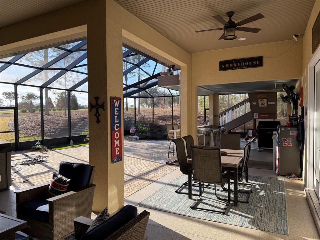 17898 Southwest 72nd Street Road Dunnellon, FL 34432 - Photo 71 of 85 a view of a livingroom with furniture and a floor to ceiling window
