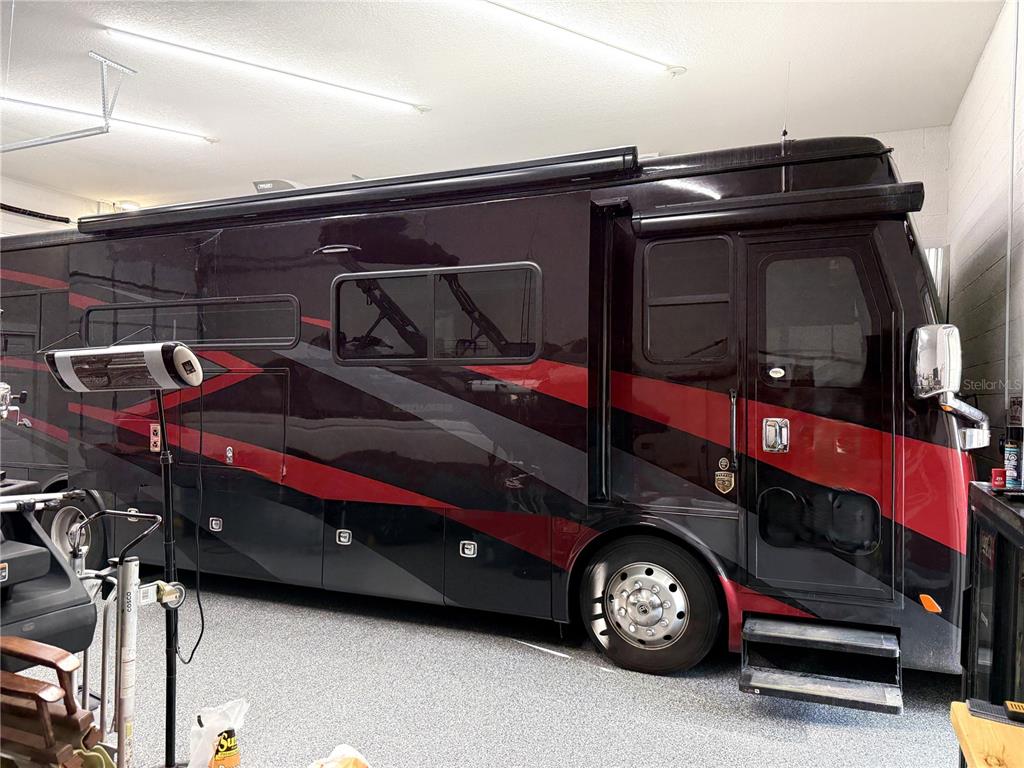 17898 Southwest 72nd Street Road Dunnellon, FL 34432 - Photo 9 of 85 a car parked in a garage