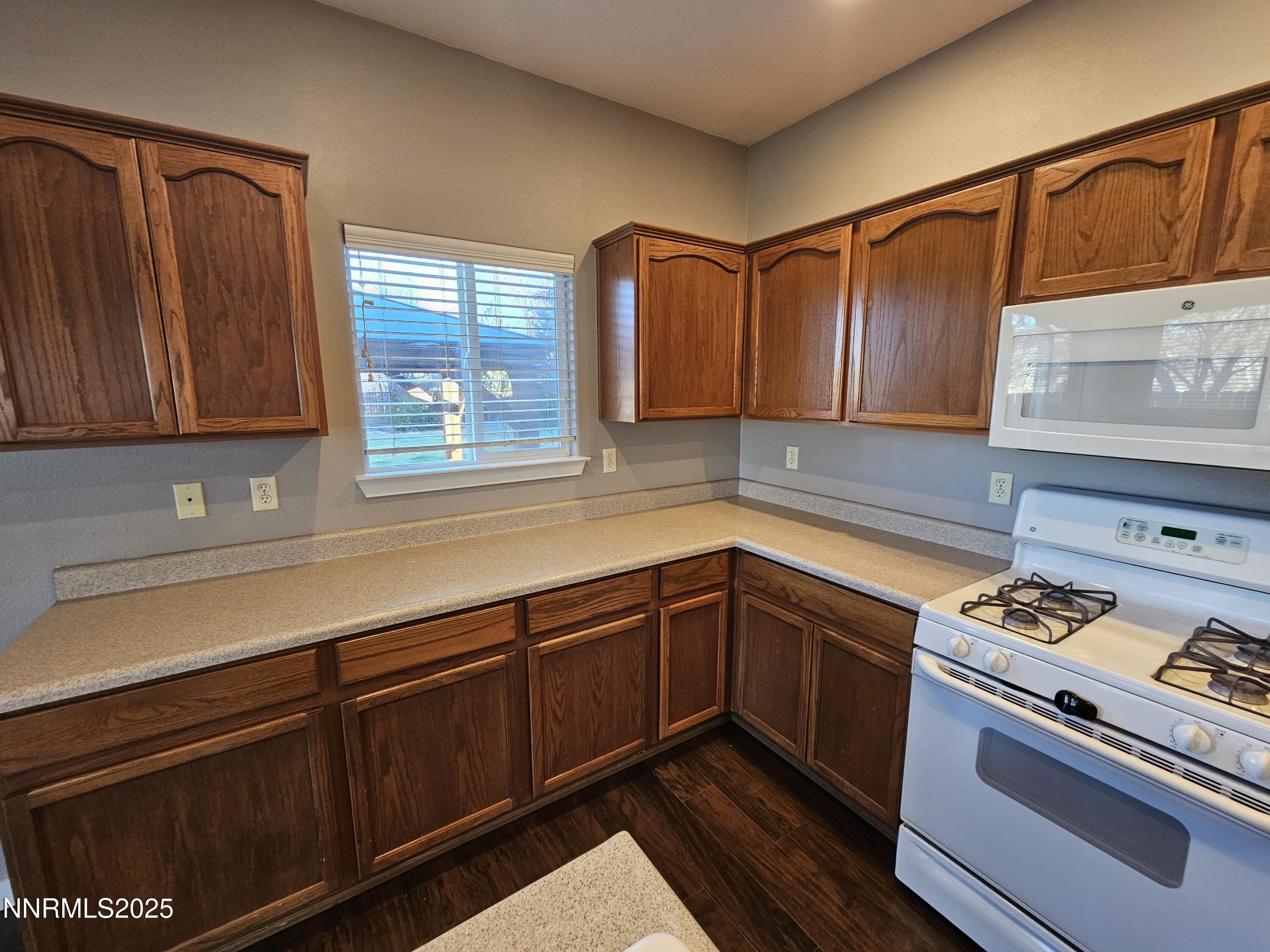 7698 Quarry Rock Court Reno, NV 89506 - Photo 13 of 33 a kitchen with sink cabinets and window