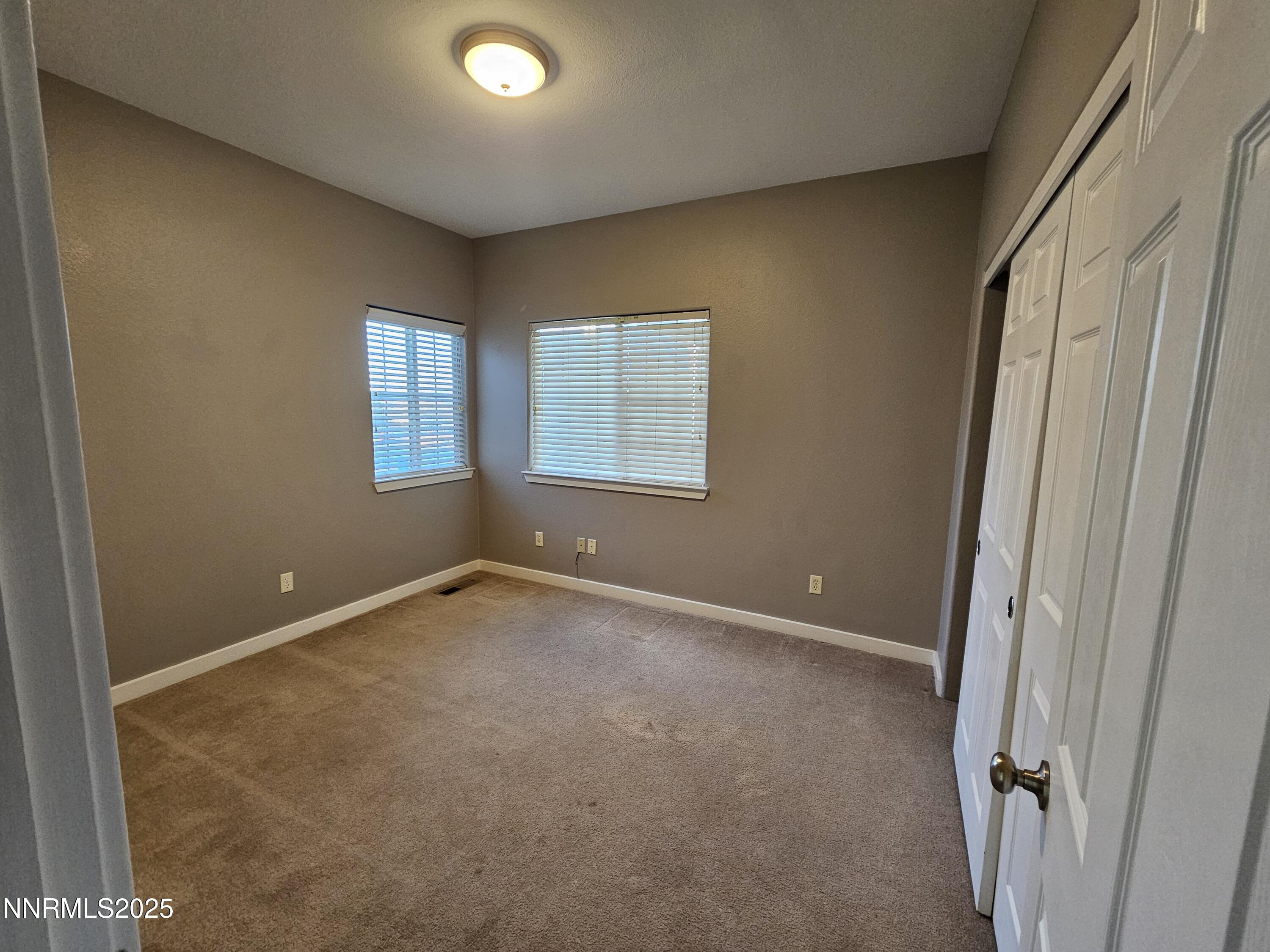 7698 Quarry Rock Court Reno, NV 89506 - Photo 22 of 33 an empty room with windows
